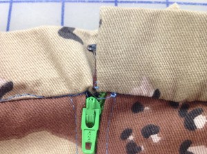 If I sewed the waistband on evenly, the teeth on the right wouldn't be visible.  Unpick and do again.