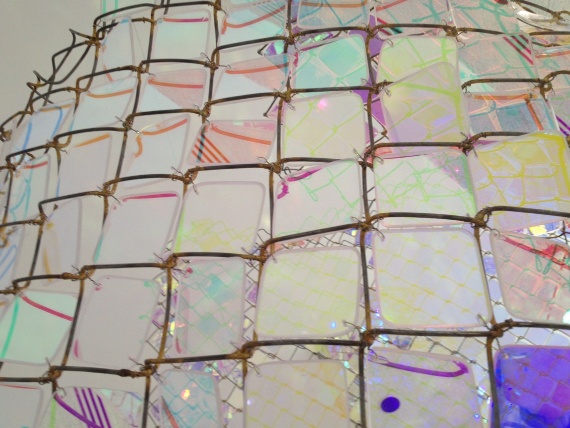 Wires and airconditioning units creating multi-coloured lines